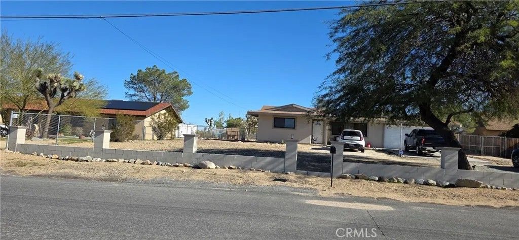 Photo of 7115 Rubidoux Ave, Yucca Valley, CA 92284 (MLS # IV26006901)