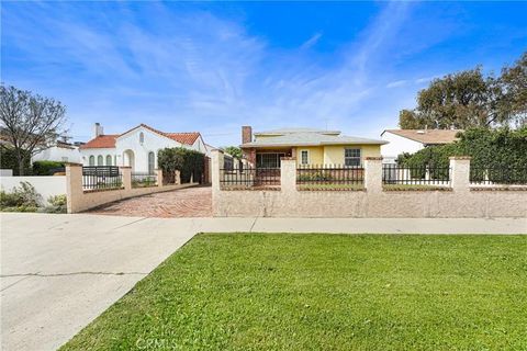 Photo of 1009 S Rimpau Blvd, Los Angeles, CA 90019 (MLS # HD26011212)