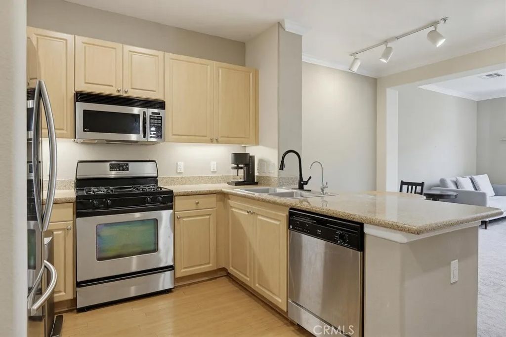 Photo of 2448 Watermarke Pl, Irvine, CA 92612 (MLS # OC26079520)