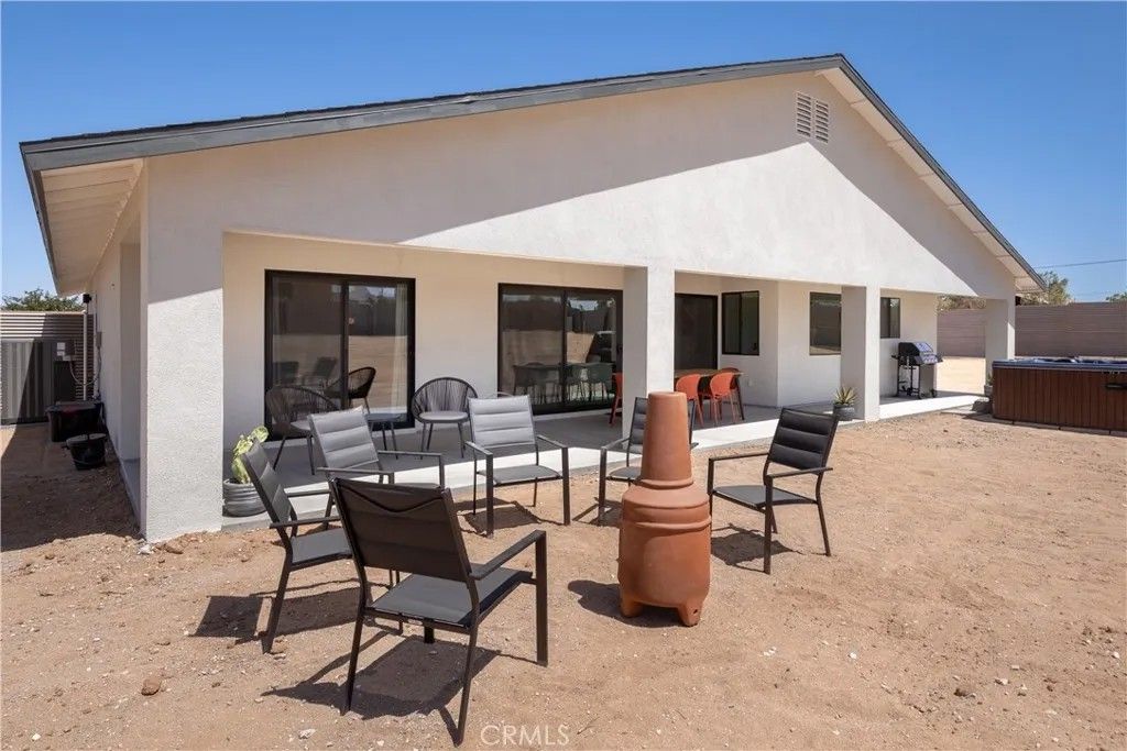 Photo of 3848 Ruidosa Avenue, Yucca Valley, CA 92284 (MLS # JT26053903)