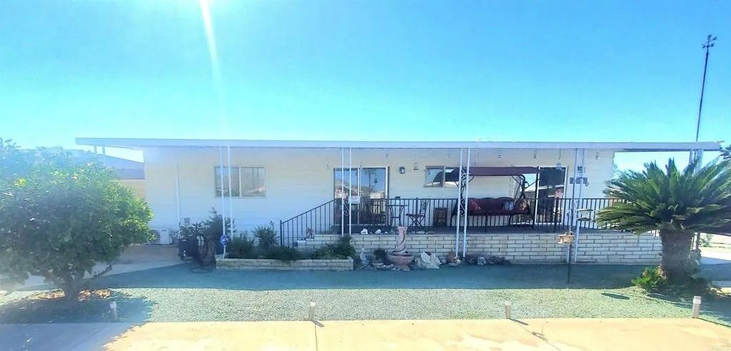 Photo of 26056 Butterfly Palm Dr, Homeland, CA 92548 (MLS # NDP2601512)