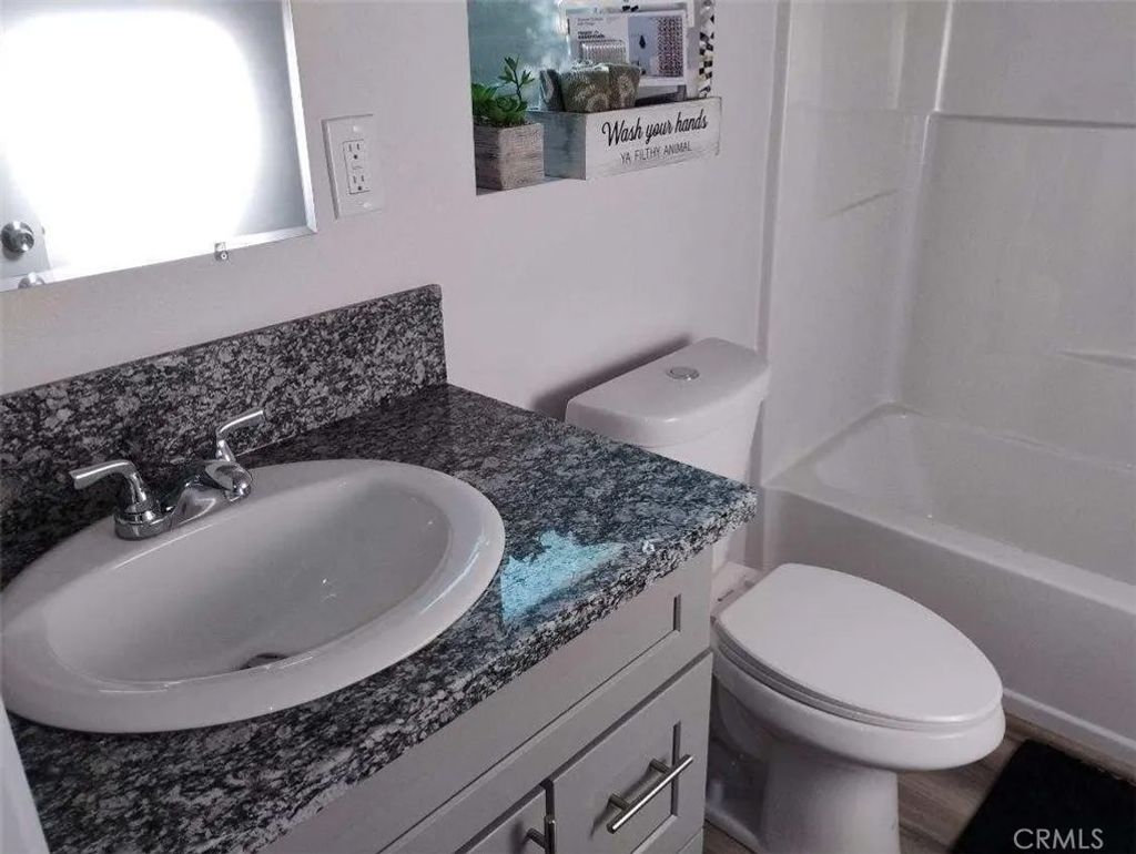 Photo of 1901 N Grape, Compton, CA 90222 (MLS # RS26032136)