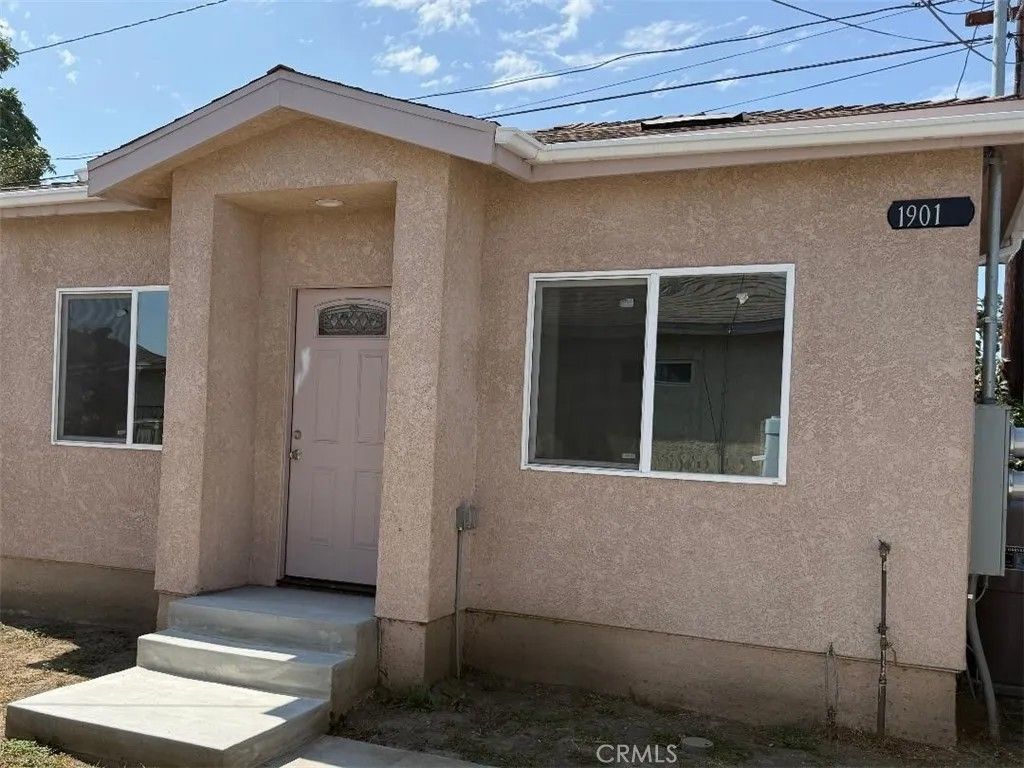 Photo of 1901 N Grape, Compton, CA 90222 (MLS # RS26032136)