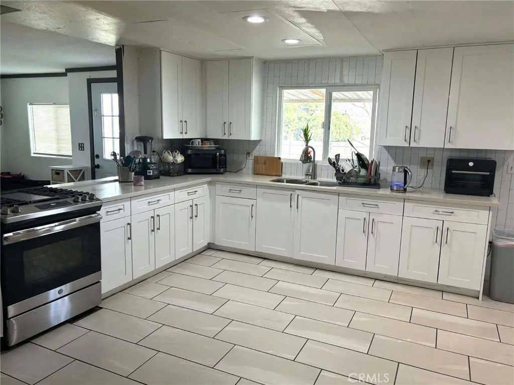 Photo of 31721 Meadow Blossom Dr, Nuevo, CA 92567 (MLS # IV26034268)