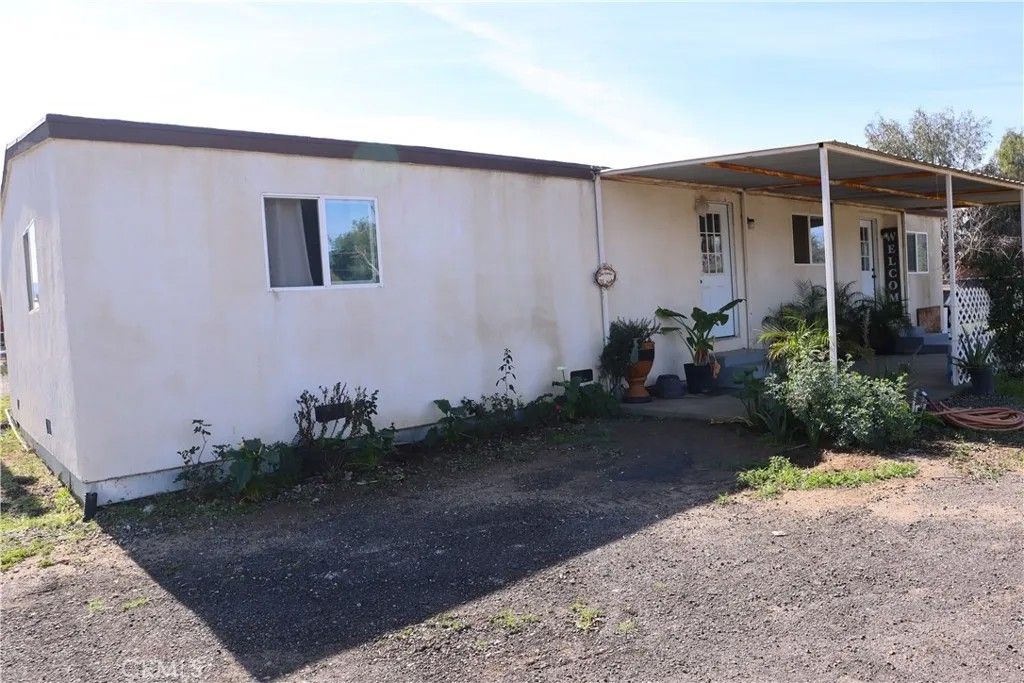 Photo of 31721 Meadow Blossom Dr, Nuevo, CA 92567 (MLS # IV26034268)