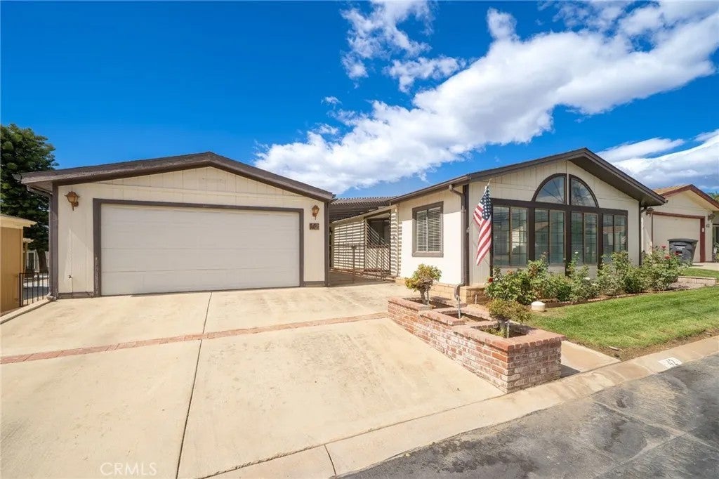 Photo of 10961 Desert Lawn DR #42, Calimesa, CA 92320 (MLS # CV26213466)
