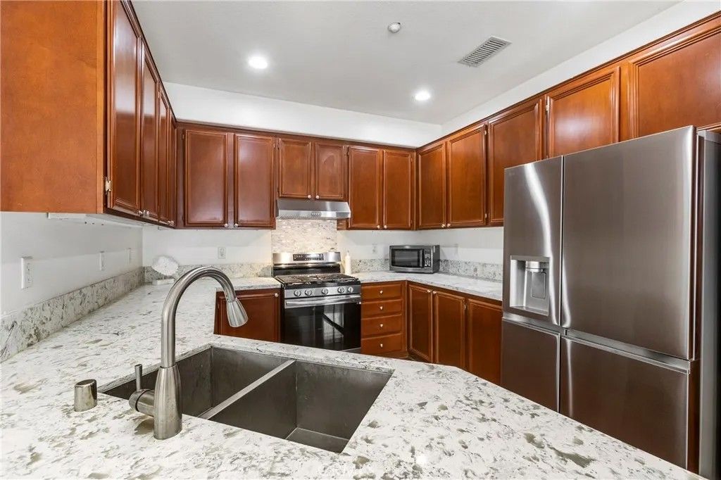 Photo of 23 Poppy, Irvine, CA 92618 (MLS # OC26086426)