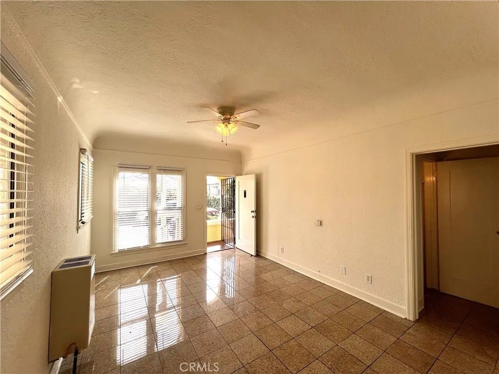 Photo of 3919 Walton Avenue, Los Angeles, CA 90037 (MLS # SB26088573)