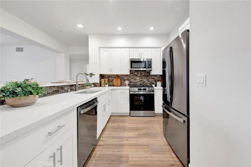 Photo of 24545 Town Center Dr #5304, Valencia, CA 91355 (MLS # SR26054486)