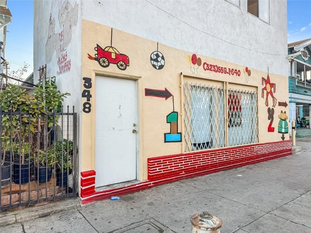 Photo of 348 W Vernon Avenue, Los Angeles, CA 90037 (MLS # MB26097943)