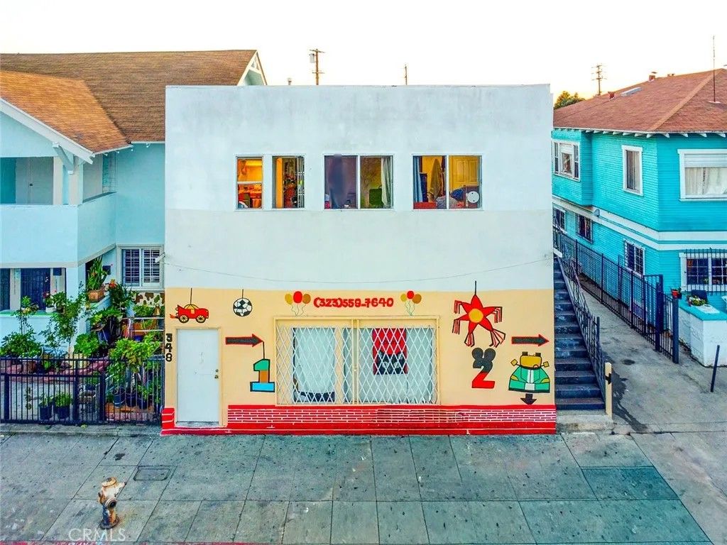 Photo of 348 W Vernon Avenue, Los Angeles, CA 90037 (MLS # MB26097943)