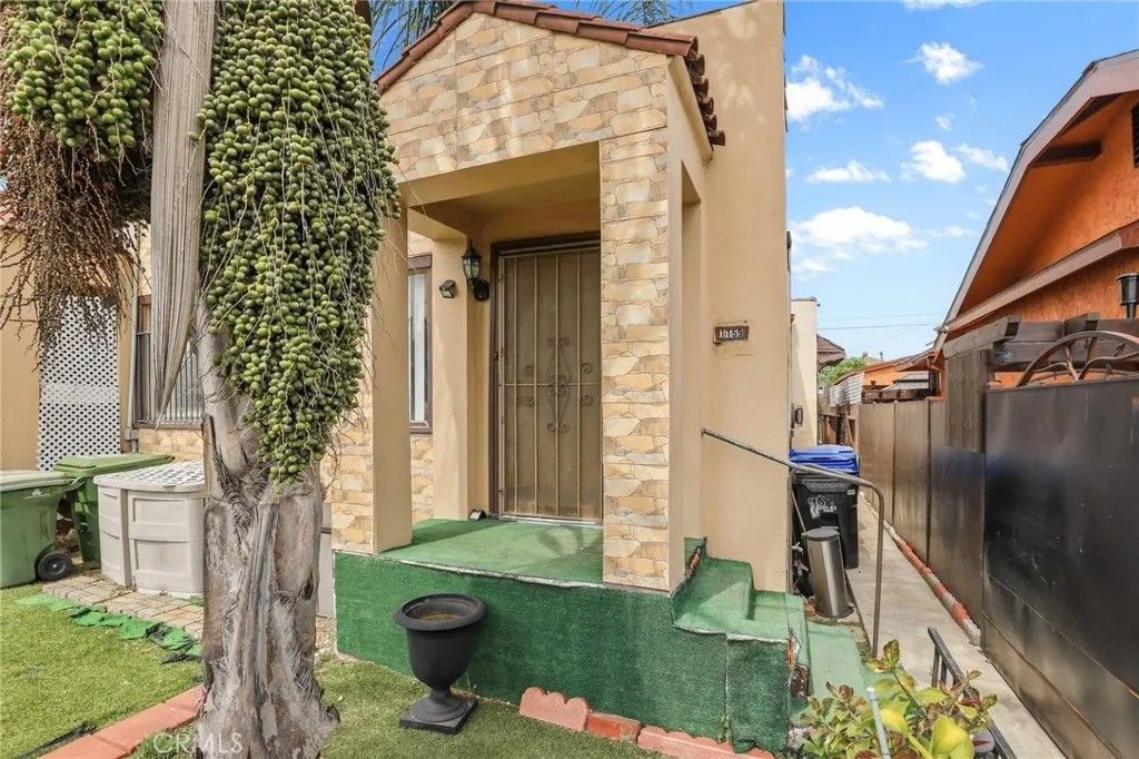 Photo of 1159 W 54th Street, Los Angeles, CA 90037 (MLS # PW26069475)