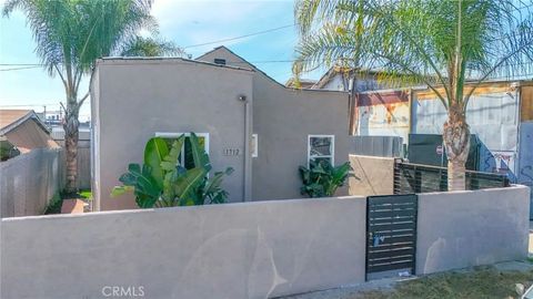 Photo of 1712 E 57th St, Los Angeles, CA 90058 (MLS # DW26043659)