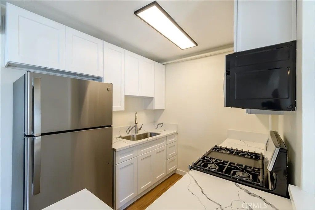 Photo of 12571 Kensington Lane #6, Garden Grove, CA 92840 (MLS # PW26079622)