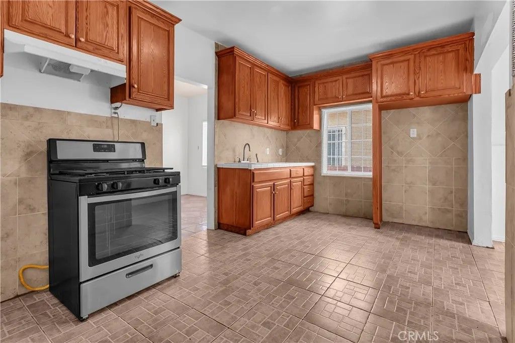 Photo of 657 E 53rd St, Los Angeles, CA 90011 (MLS # DW26015706)