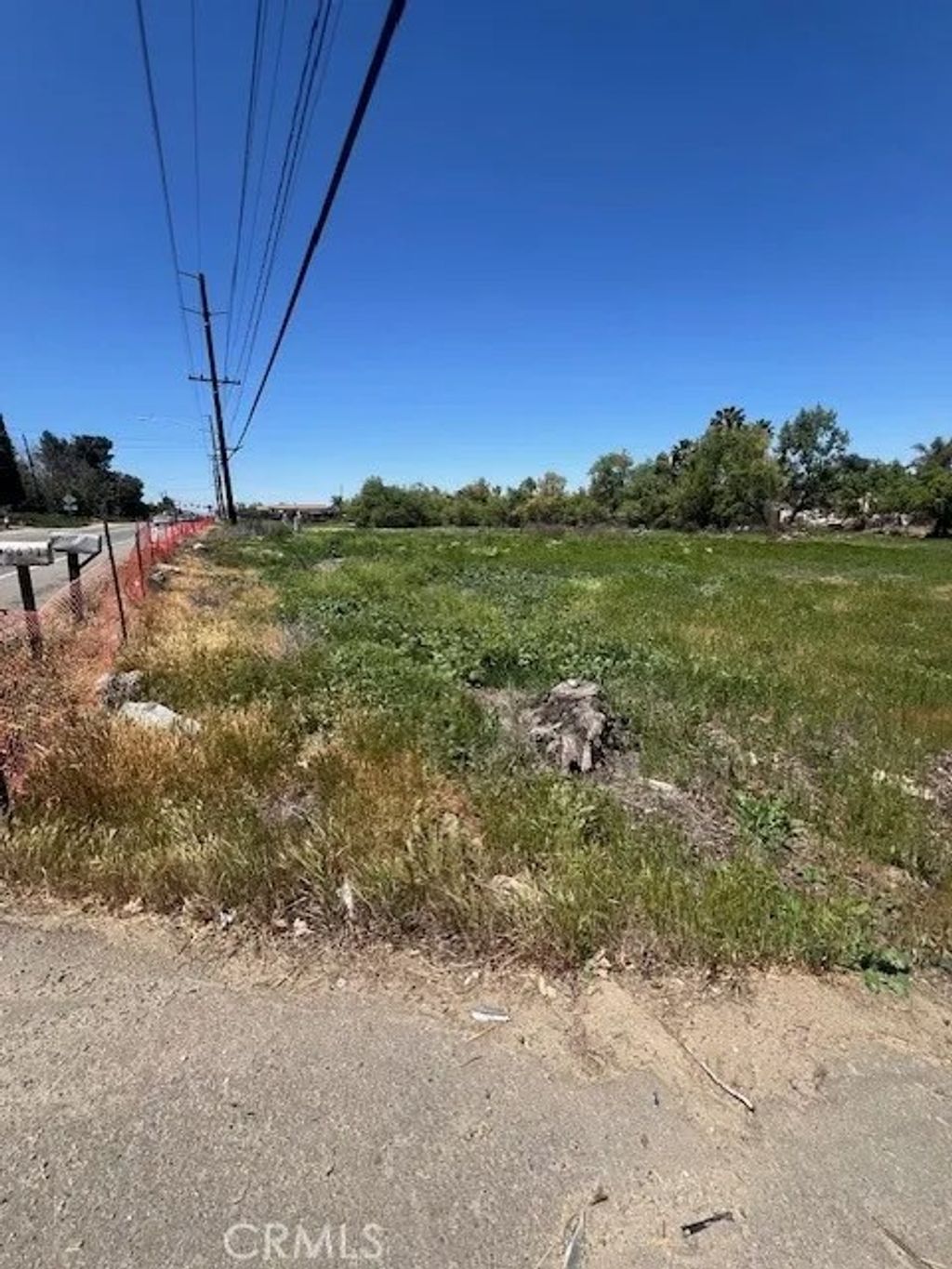 Photo of 0 Cajalco Rd, Perris, CA 92570 (MLS # PW25128871)