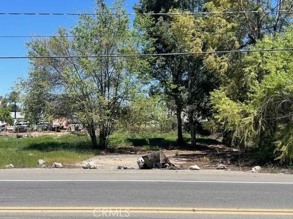 Photo of 0 Cajalco Rd, Perris, CA 92570 (MLS # PW25128871)