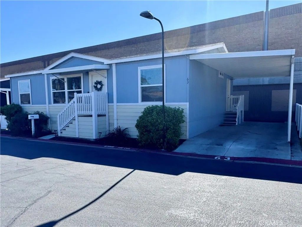 Photo of 995 Pomona Rd #63, Corona, CA 92882 (MLS # IG26028624)