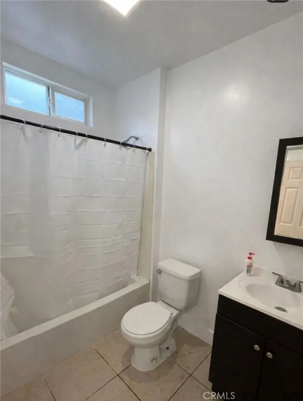 Photo of 5610 S Saint Andrews Pl, Los Angeles, CA 90062 (MLS # DW26031080)