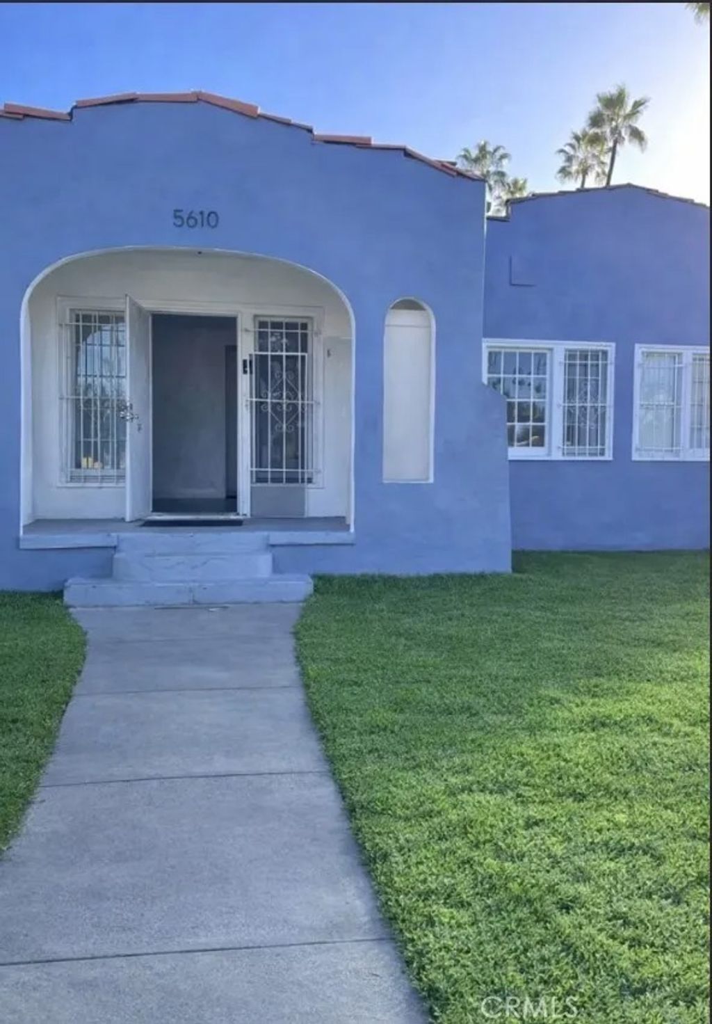 Photo of 5610 S Saint Andrews Pl, Los Angeles, CA 90062 (MLS # DW26031080)