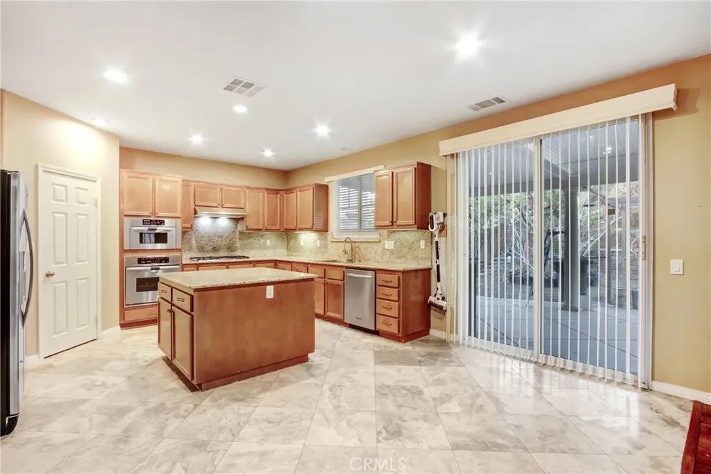 Photo of 41031 Crimson Pillar Ln, Lake Elsinore, CA 92532 (MLS # TR26040323)