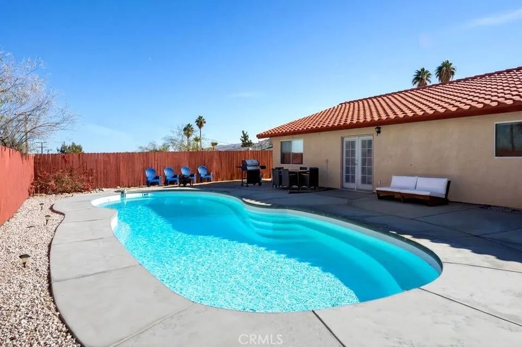 Photo of 71620 Juanita Drive, 29 Palms, CA 92277 (MLS # JT25275978)