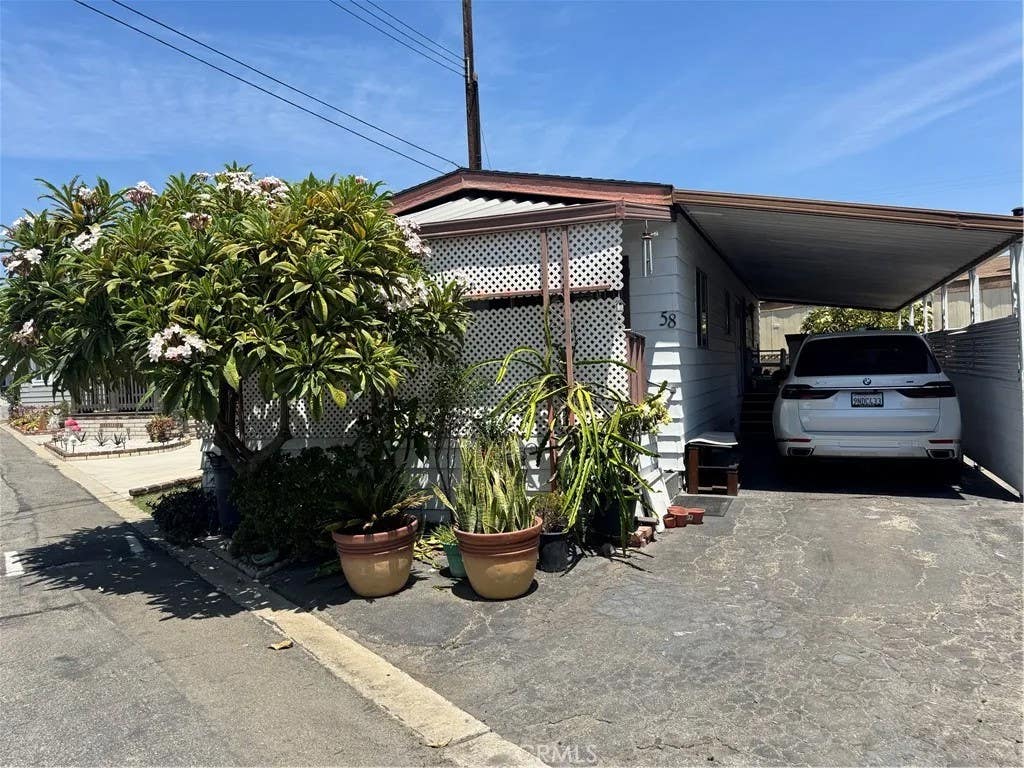 Photo of 12737 Rosecrans Ave #58, Norwalk, CA 90650 (MLS # PW26179170)