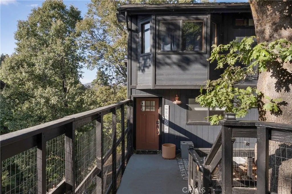 Photo of 290 Davos Drive, Crestline, CA 92325 (MLS # CV25273632)