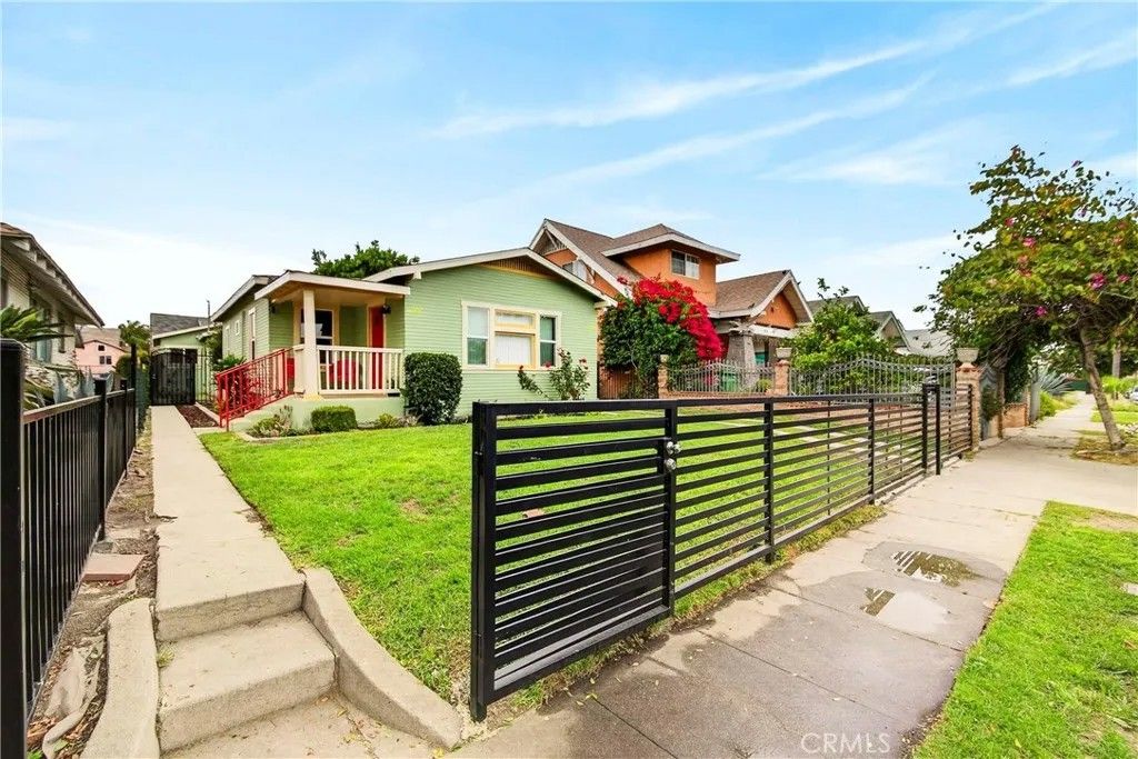 Photo of 917 W 50th Place, Los Angeles, CA 90037 (MLS # SB26030174)