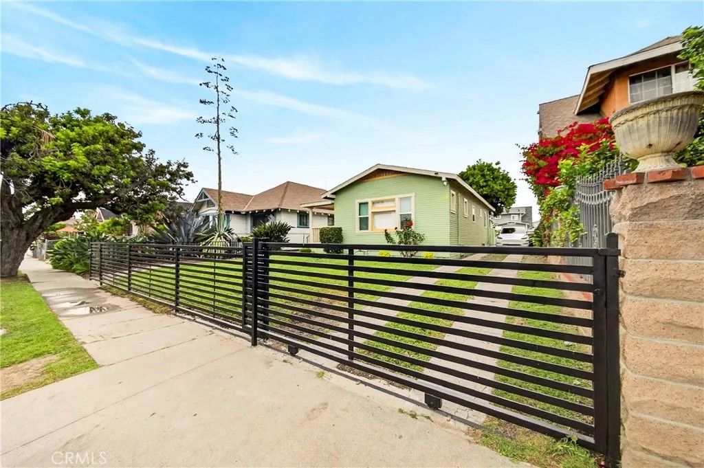 Photo of 917 W 50th Place, Los Angeles, CA 90037 (MLS # SB26030174)