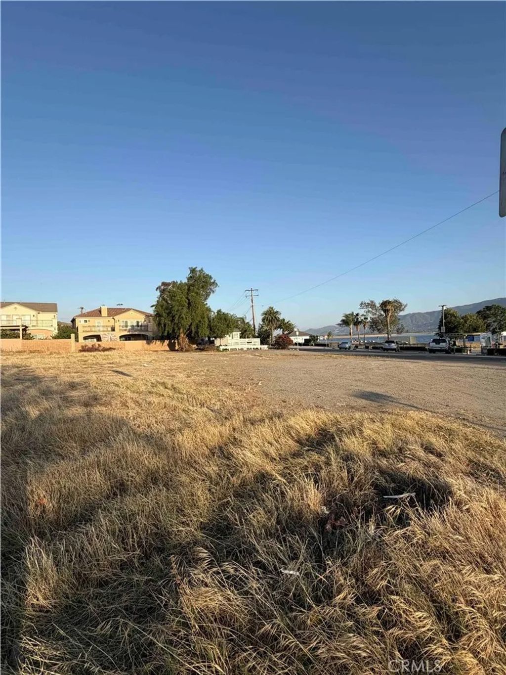 Photo of 0 lakeshore, Lake Elsinore, CA 92530 (MLS # SW26108545)