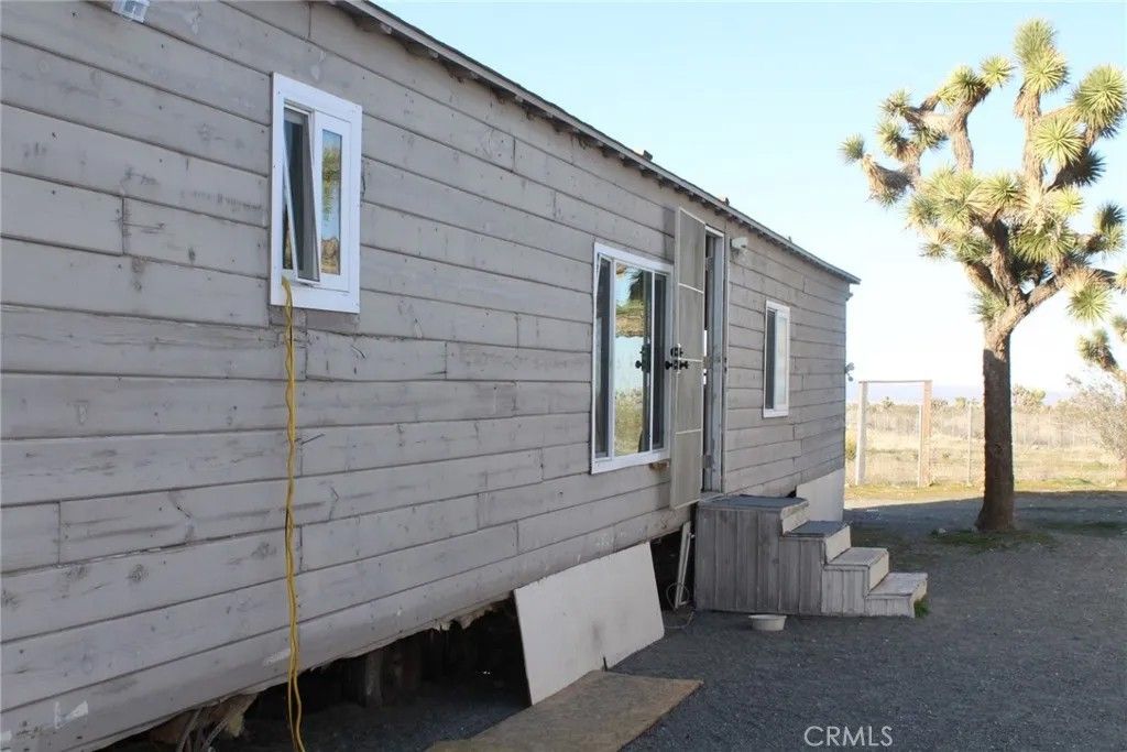 Photo of 12543 Buckwheat Rd, Phelan, CA 92371 (MLS # HD26023866)