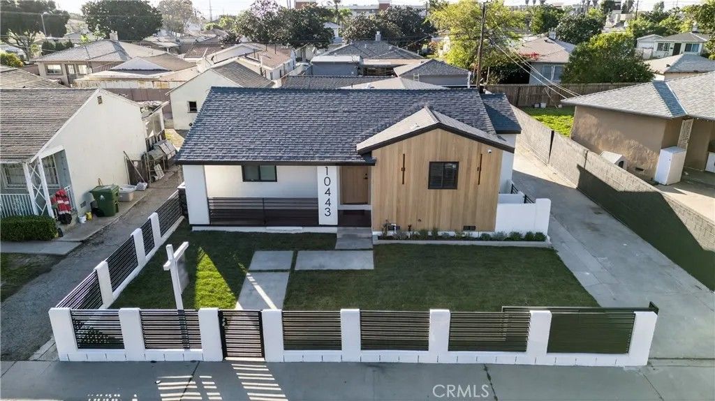 Photo of 10443 E Zamora Avenue, Los Angeles, CA 90002 (MLS # DW26033431)