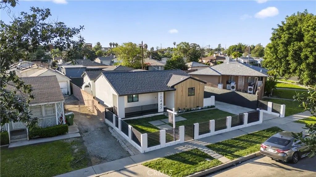 Photo of 10443 E Zamora Avenue, Los Angeles, CA 90002 (MLS # DW26033431)
