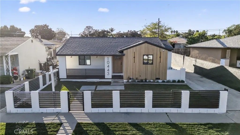 Photo of 10443 E Zamora Avenue, Los Angeles, CA 90002 (MLS # DW26033431)