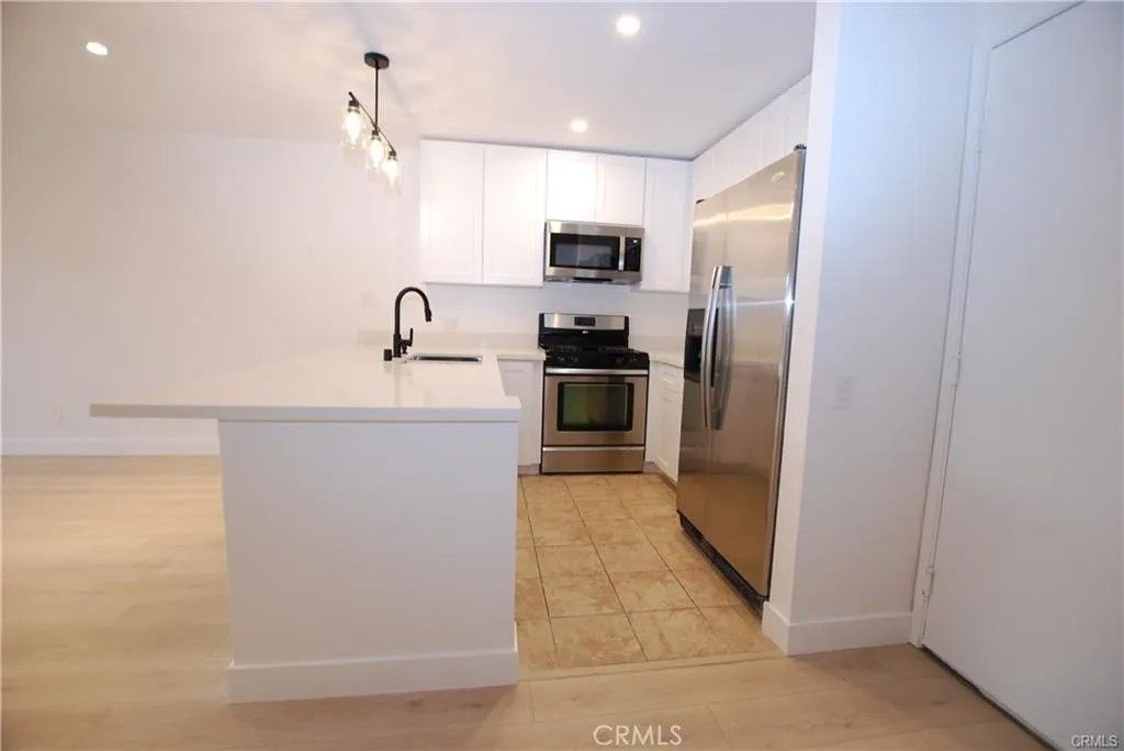 Photo of 6820 Remmet Ave, Canoga Park, CA 91303 (MLS # SR26049408)