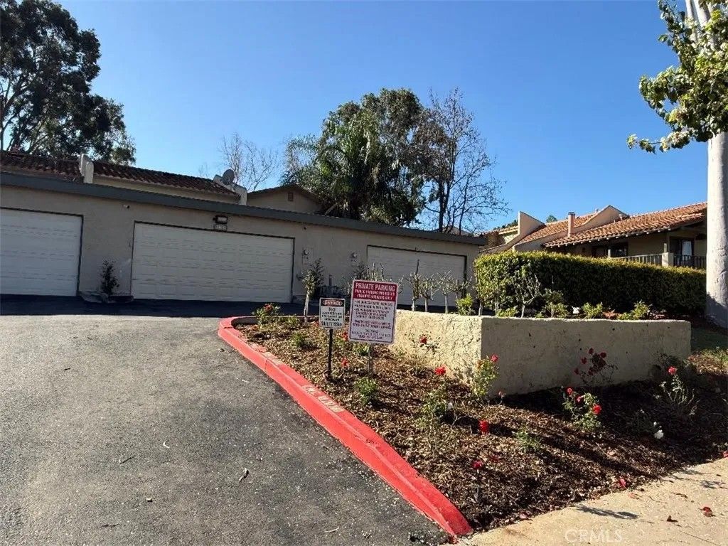 Photo of 1466 Camelot Dr, Corona, CA 92882 (MLS # OC26032032)