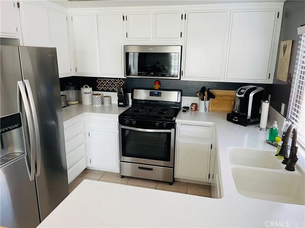 Photo of 7881 Woodlake Dr, Huntington Beach, CA 92647 (MLS # OC25237064)