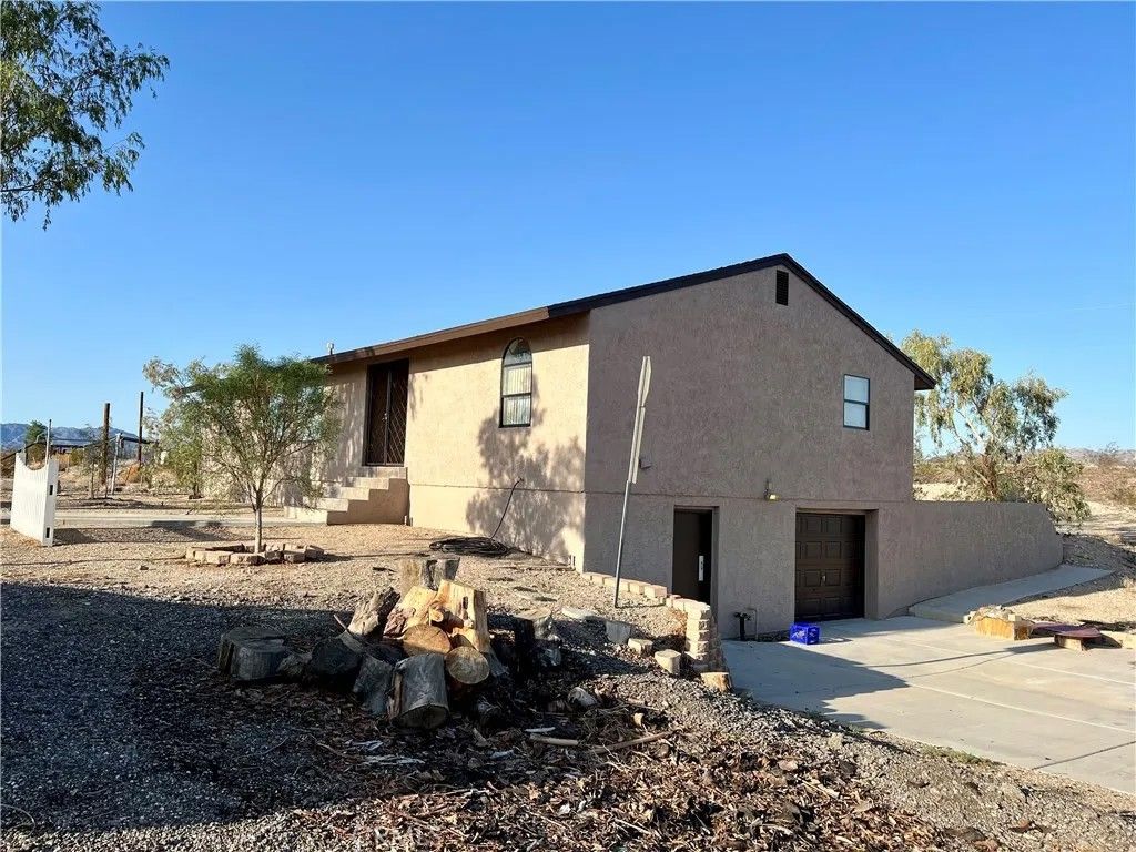 Photo of 99 Zoe Lane, Needles, CA 92363 (MLS # JT26070962)
