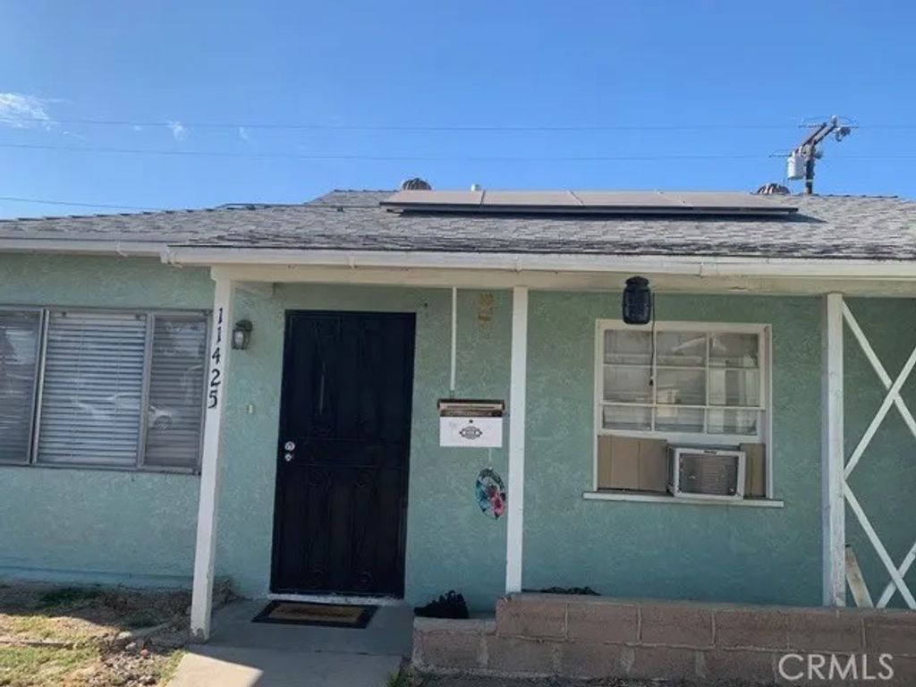 Photo of 11425 Alburtis Avenue, Norwalk, CA 90650 (MLS # IV26012369)