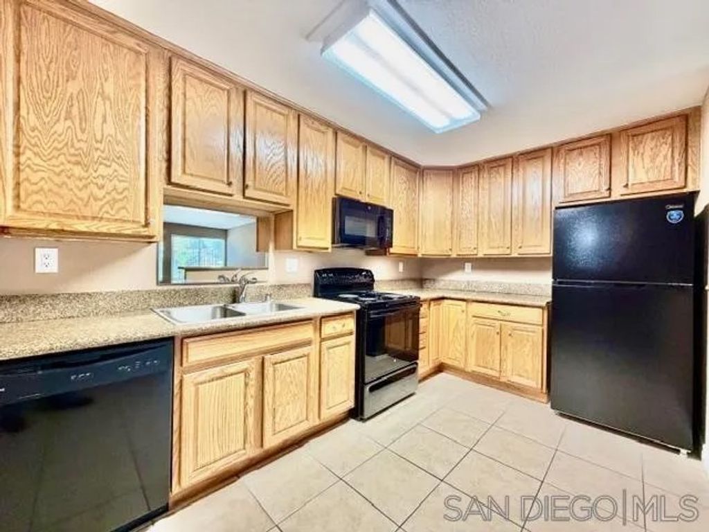 Photo of 1845 Bayview Heights Dr #103, San Diego, CA 92105 (MLS # 250045332)
