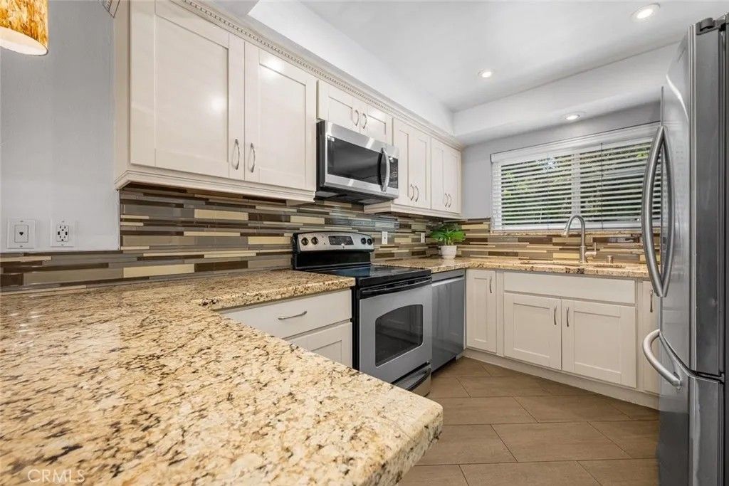 Photo of 1881 Mitchell Avenue #124, Tustin, CA 92780 (MLS # PW26073500)
