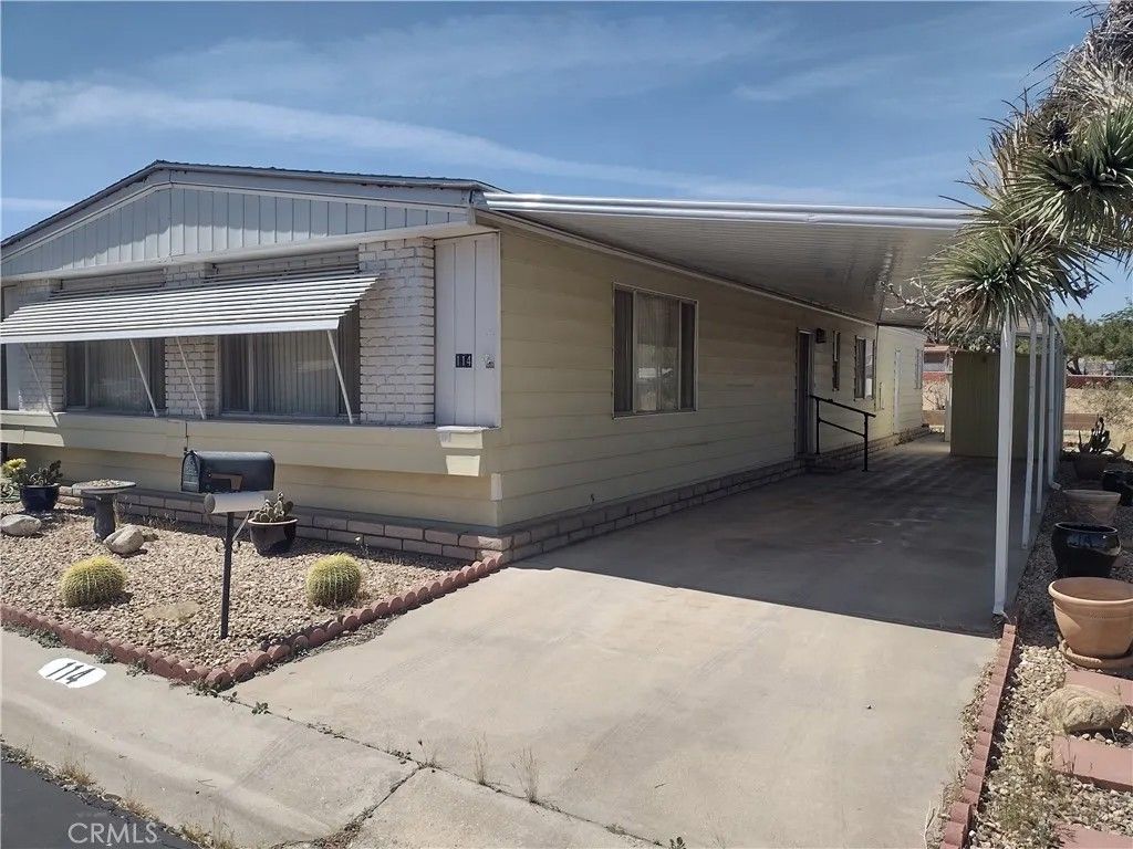 Photo of 7501 Palm Ave #114, Yucca Valley, CA 92284 (MLS # HD26076630)