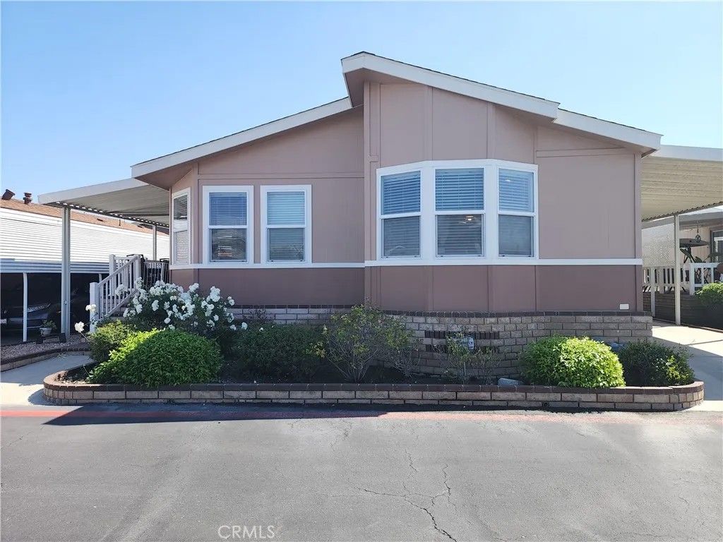 Photo of 9850 Garfield Ave #113, Huntington Beach, CA 92646 (MLS # OC26067259)