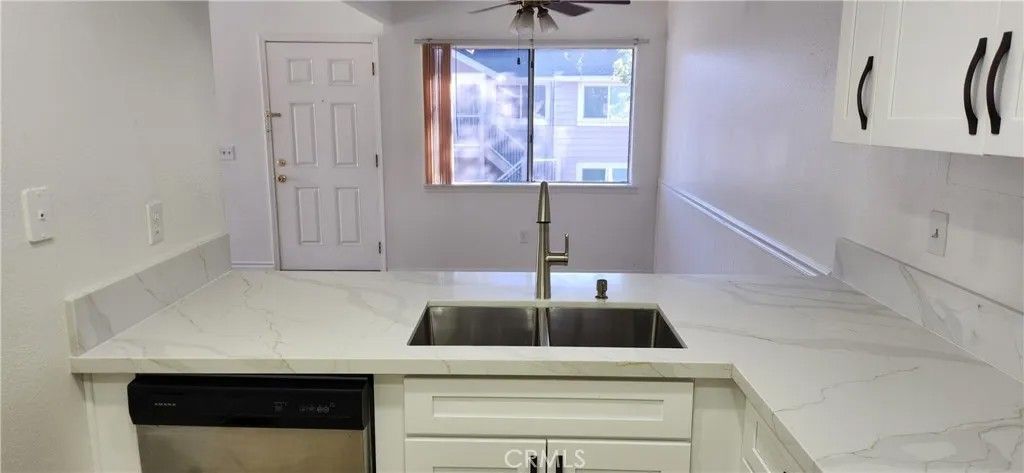 Photo of 713 Walnut Drive, Lake Elsinore, CA 92530 (MLS # OC25240332)