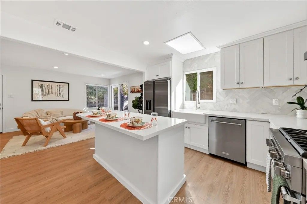 Photo of 302 Cleveland Dr, Huntington Beach, CA 92648 (MLS # OC25250695)