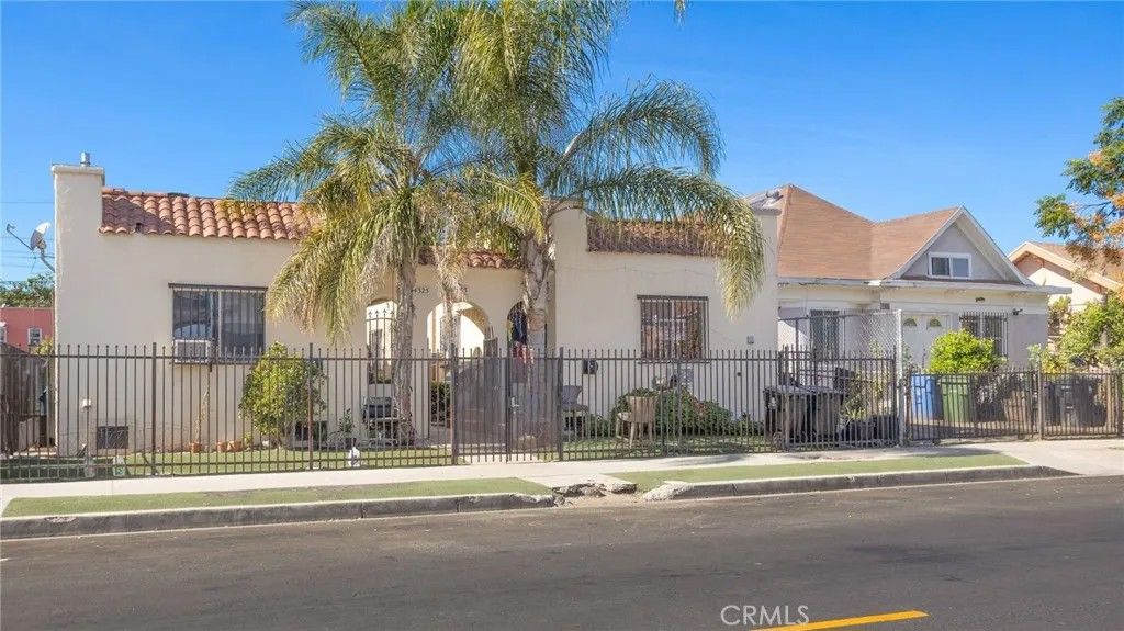 Photo of 4323 Woodlawn Avenue, Los Angeles, CA 90011 (MLS # SB26071452)