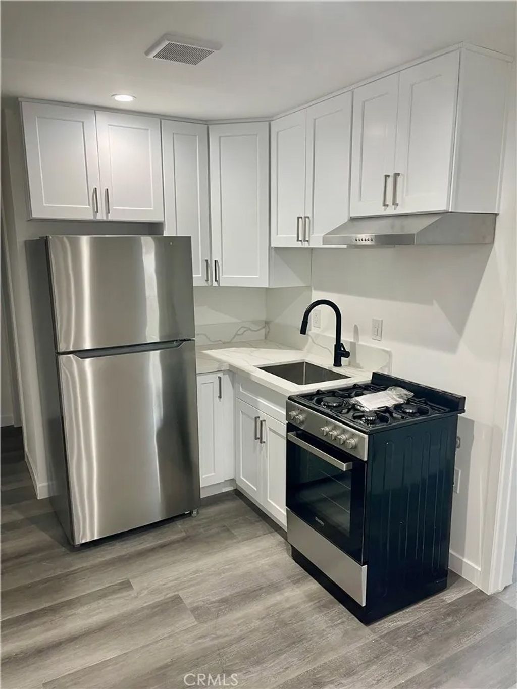 Photo of 1118 E Arlington St, Compton, CA 90221 (MLS # OC26013440)