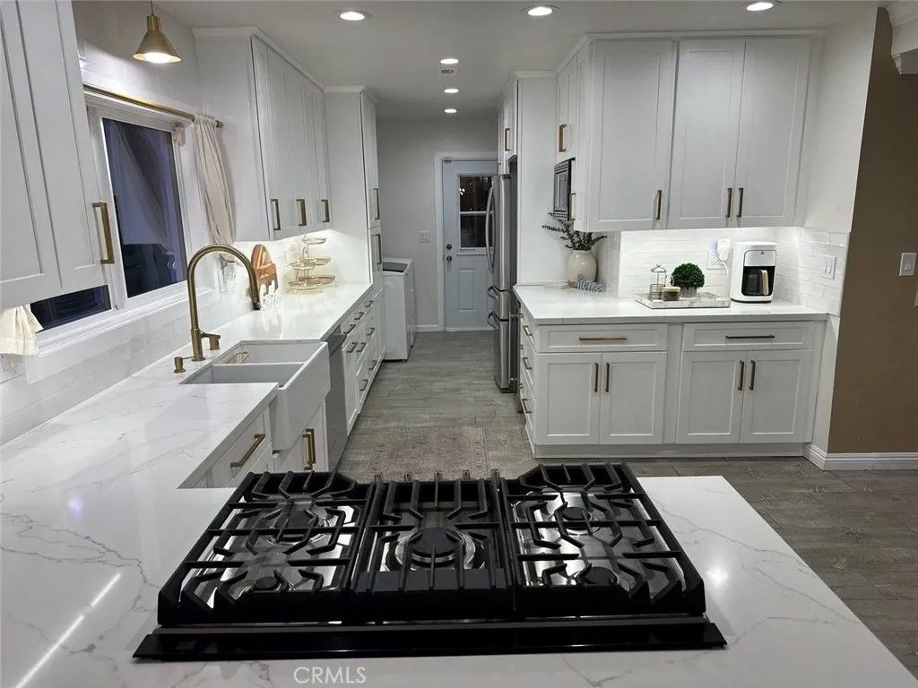 Photo of 12280 Caladre Ave, Downey, CA 90242 (MLS # DW25276167)