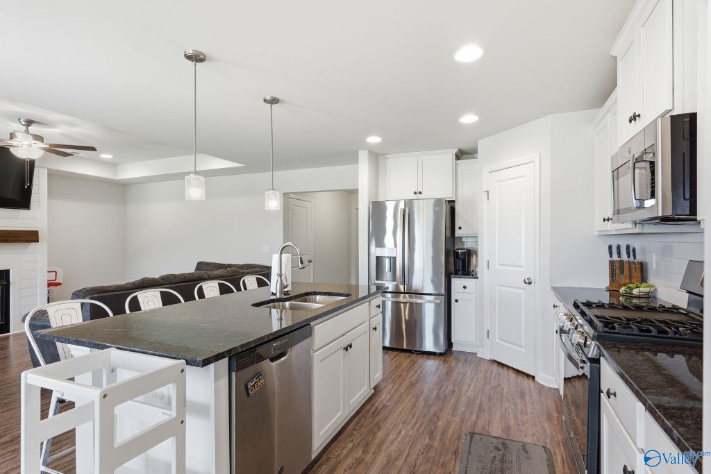 Kitchen island with pendant lights and gas range
